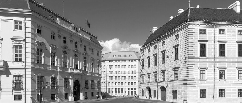 Ein dunkler Schatten hat sich über den Ballhausplatz in Wien gelegt: links das Bundeskanzleramt und Außenministerium, rechts der Sitz des Bundespräsidenten. Grün läßt das Land nicht erblühen, sondern stürzt es in Zerrüttung, Hader, Chaos und Dunkelheit.